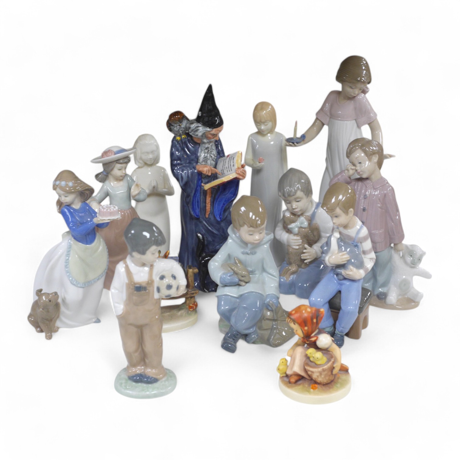 A Royal Doulton figure ‘The Wizard’ HN 2877, together with a quantity of Nao figures, Royal Worcester and Hummel figures, The Wizard 25cm high. Condition - Hummel figure chip to hat, NAO figure with candle holder, opposi